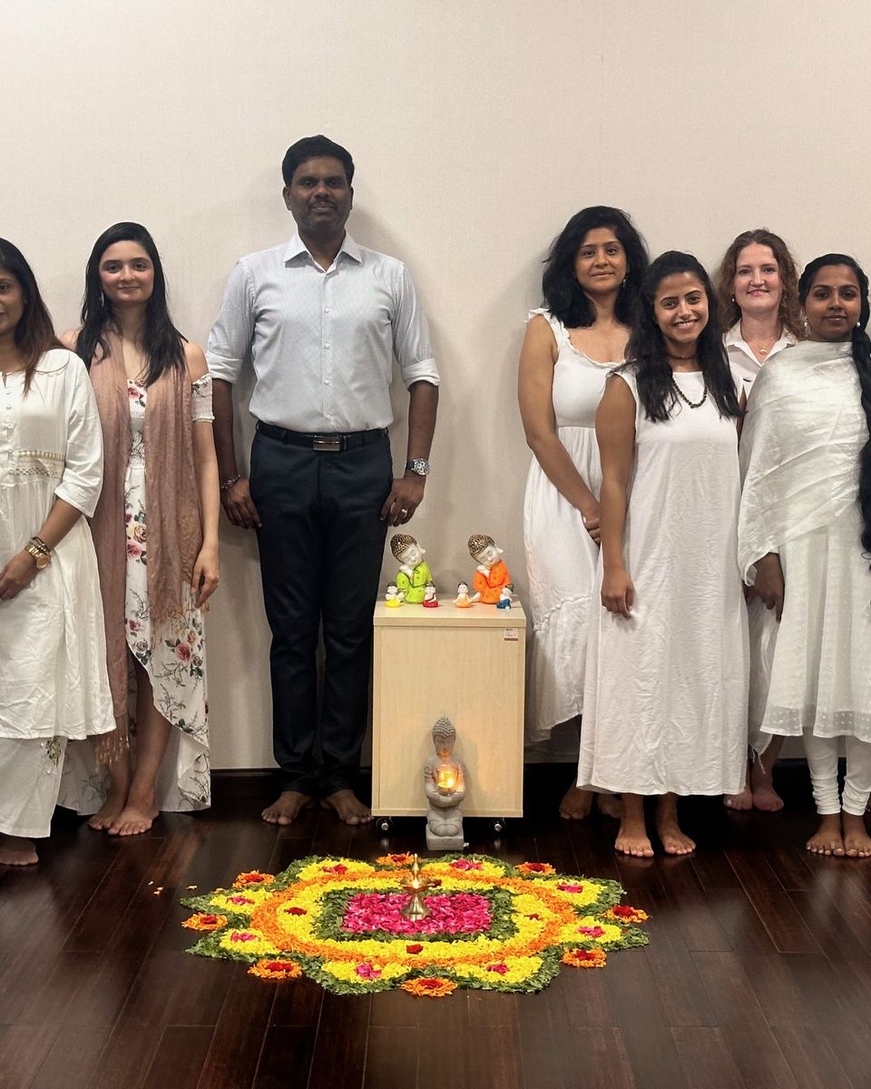 Dr. Kasi with yoga teacher training graduates in Dubai